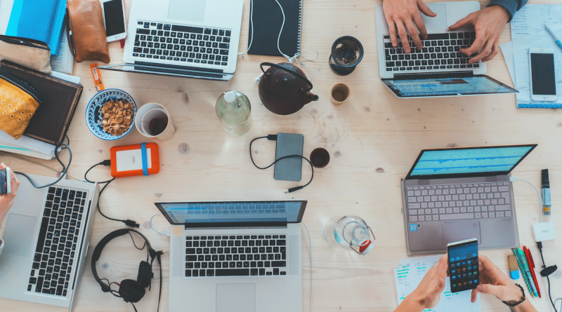 Top down view of people working at laptops